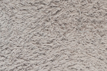 Soft gray rug texture with thick fibers in indoor setting