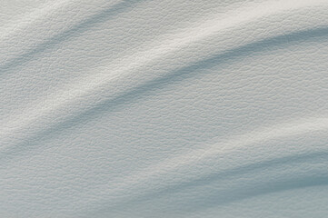 Smooth texture of light-colored material with subtle patterns