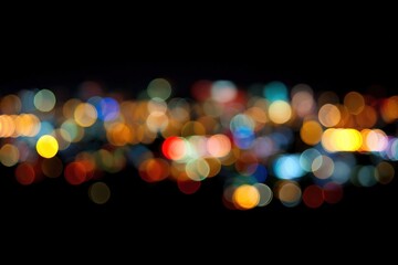 Vibrant bokeh lights against dark background in abstract urban scene