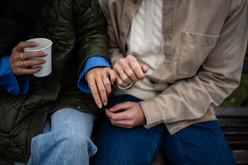 Couple hands showing wedding rings together