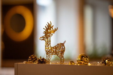 A decorative golden glitter reindeer figurine
