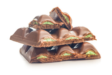 Chocolate bar with pistachios cream isolated on white background.