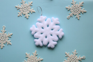 White snowflakes on a blue background.
