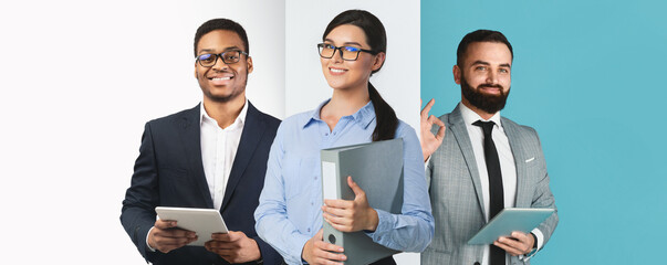 Three business people stand in a bright and stylish office environment. They are holding tablets and smiling confidently, showcasing teamwork and professionalism in a collaborative setting.