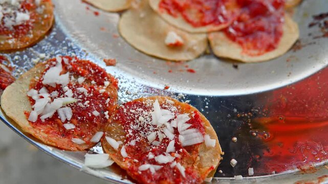 Chef preparing traditional mexican chalupas poblanas