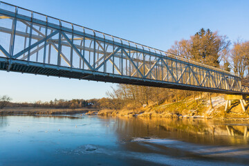 Fototapeta premium Bridge Over The River With Autumn Trees