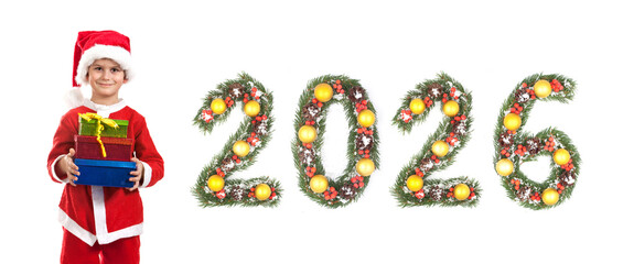Boy Dressed as Santa Claus Holding Gift Box Beside Christmas New Year 2026 Evergreen Branch Number Decoration on a white background