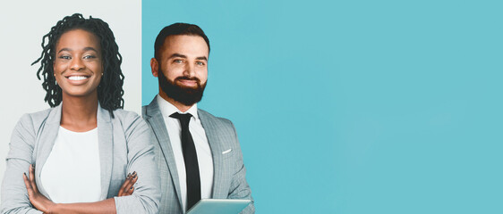 A diverse group of business professionals stand confidently in a bright office space. The individuals smile warmly as they engage in a business collaboration.