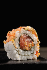 Close-up of Fresh Sushi Roll on Dark Background