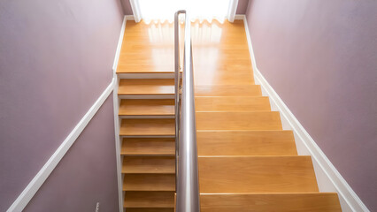 Modern Wooden Staircase Leading Upwards with Metallic Handrail and Bright Light in a Contemporary Interior