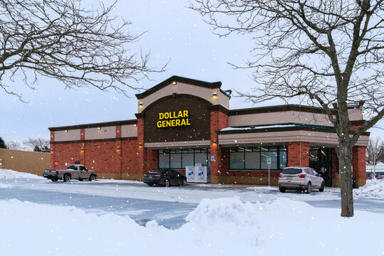 Utica, NY - Dec 9, 2025: Dollar General, with a winter snowfall, is a U.S. discount retailer founded in 1939, operating over 19,000 stores nationwide with a focus on low-cost everyday essentials