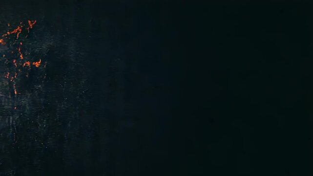 Abstract grunge background with orange light and dark texture