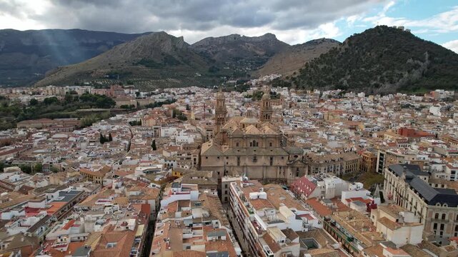 Enjoy a Scenic Aerial View of a Beautiful Historic City Surrounded by Majestic Mountains