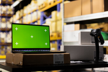 Fulfillment center with copy space screen supporting express delivery and order processing with a scanner at the desk, large business operations with reliable logistics and packaging.