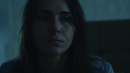 A young woman sits on her bed at night, overwhelmed and unfocused. Her foggy mind and emotional exhaustion reflect insomnia, inner struggle, and mental disorientation. 