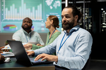 Business analyst reviewing budgeting and project updates numbers, ensuring organizational success and allocating resources according to the market needs. Coworkers achieving goals.