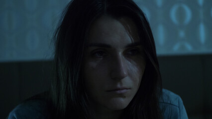 A young woman sits on her bed at night, overwhelmed and unfocused. Her foggy mind and emotional exhaustion reflect insomnia, inner struggle, and mental disorientation. 