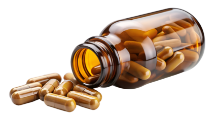 Amber medicine bottle tipped over spilling numerous brown capsules onto a dark surface for health concepts
