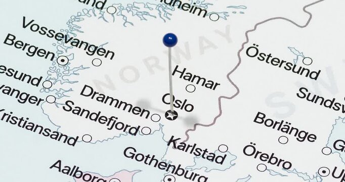 A zoom out of a blue pin into oslo city of norway political map