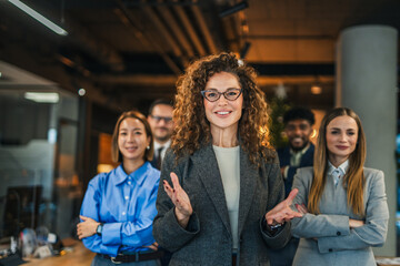 Diverse business team smiling posing in modern office