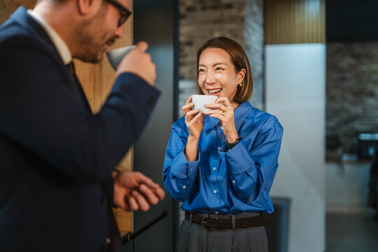 Coworkers enjoying coffee break having a business conversation