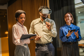 Business colleagues experiencing virtual reality technology in office
