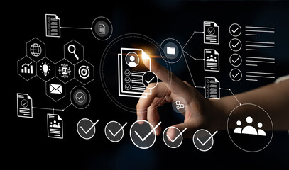 A hand reaches towards a digital interface displaying various icons related to data management and analytics, symbolizing modern technology and business operations. Gantry