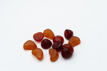 Multivitamin gummy Spilled on white background.