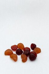 Multivitamin gummy Spilled on white background.