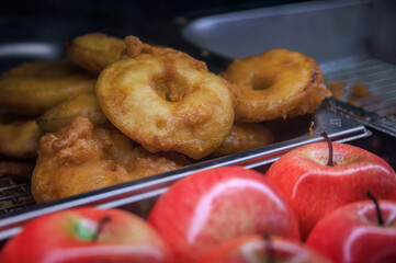 Golden fried festive Oepfelkuechli apple fritters at the Zurich Christmas market