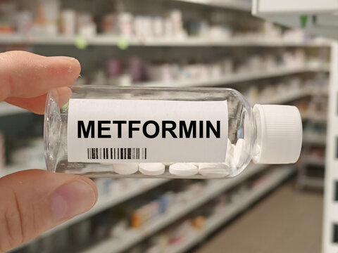 Box of METFORMIN tablets on a hospital pharmacy table used to control blood sugar in type 2 diabetes a biguanide.