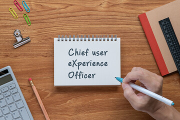 There is notebook with the word Chief user eXperience Officer. It is as an eye-catching image.