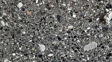 Close-up view of a dark grey stone surface.  Textured