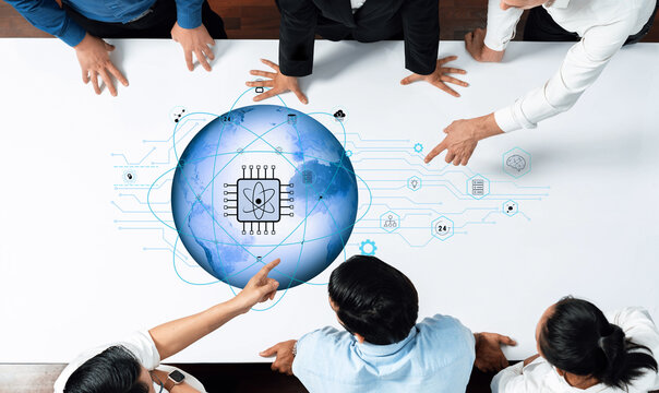 A diverse business team collaborates over a digital tabletop, analyzing global data and technological innovations, highlighting teamwork and strategic planning. Trope - Powered by Adobe