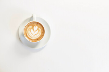 Coffee on a White Background. Coffee in a white cup with latte art. Flat lay, copy space. Cafe culture.