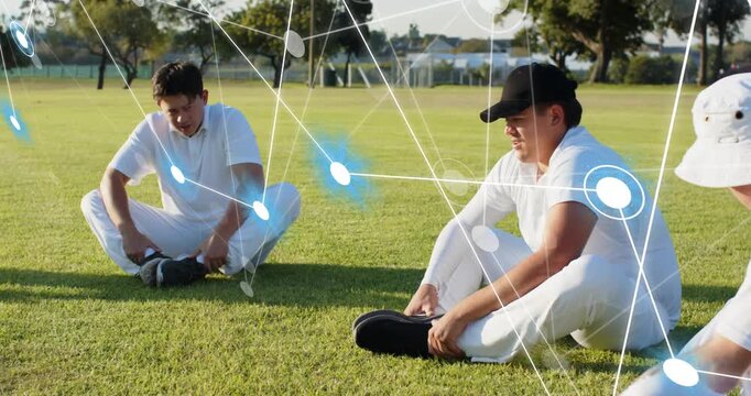 Team stretching, adjusting shoes on sports field, network appearing, highlighting shoes, warming up
