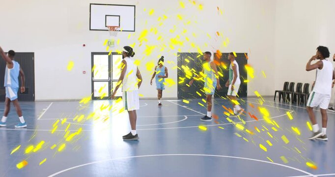 Blue player getting basketball, driving to score, defense closing, yellow sparks overlaying players