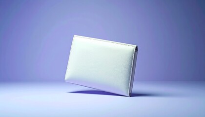 Sleek white minimalist wallet or card holder on a purple background.
