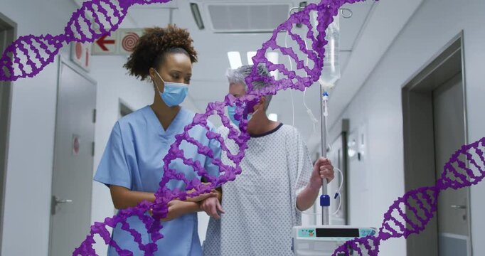 Nurse steadying patient's arm, guiding her along ward for care while purple helix tracking IV pole