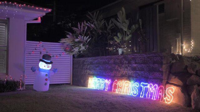 House with New Year decorations in the night, often center on driving away bad luck and ushering in good fortune, light, and warmth for the coming year