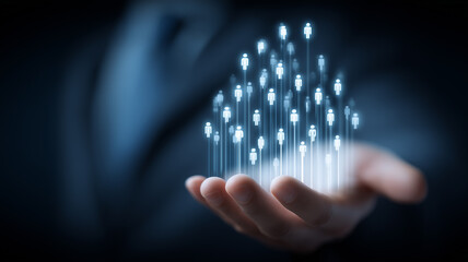 A conceptual representation of digital population growth emerging from a human hand symbolizing data expansion and human centered networks.
