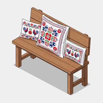 handmade embroidered decorative pillows with floral motifs on wooden bench in cozy outdoor setting