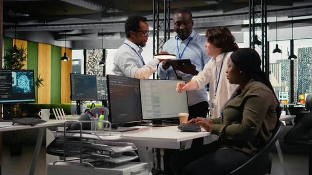 Team of admins brainstorm in AI startup office to train predictive models for language processing tasks. Teamworking colleagues use machine learning technical expertise for complex tasks, camera A