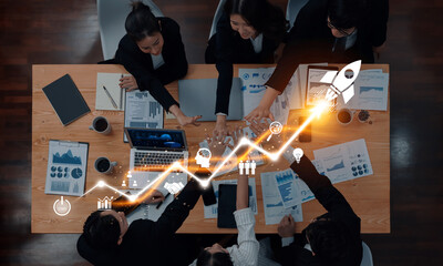 A diverse business team engages in a strategy meeting, focusing on growth and innovation. Visuals...