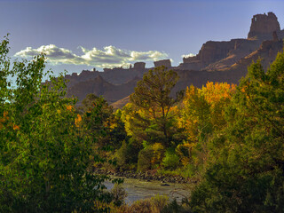 Fall hoodoos in the mountains surrounding Cody, Wyoming show colors. A turnoff on Highway 14-16-20 gives this view called Jerusalem Holy City. See  blue sky.