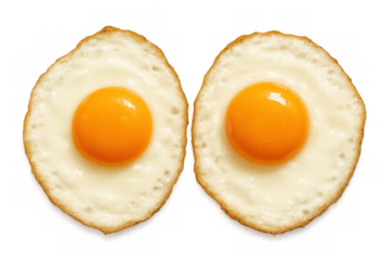 Two sunny side up fried eggs with vibrant yellow yolks and cooked whites, isolated on a transparent background, ready for breakfast