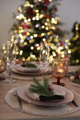 Festive table setting with Christmas decor indoors, closeup