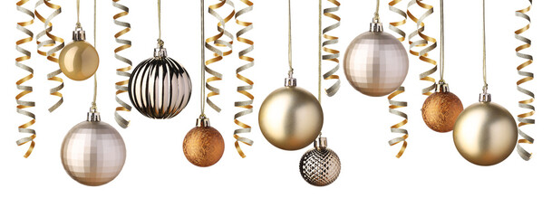 Christmas balls and golden serpentine streamers hanging on white background