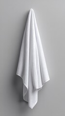 Fototapeta premium Vibrant photo of White hanging towel mockup on a grey background