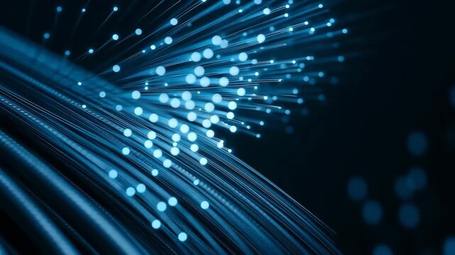 Abstract close-up of a bundle of blue fiber optic cables with glowing light points radiating from the ends, symbolizing high-speed data transmission, technology, telecommunications, networking, and di